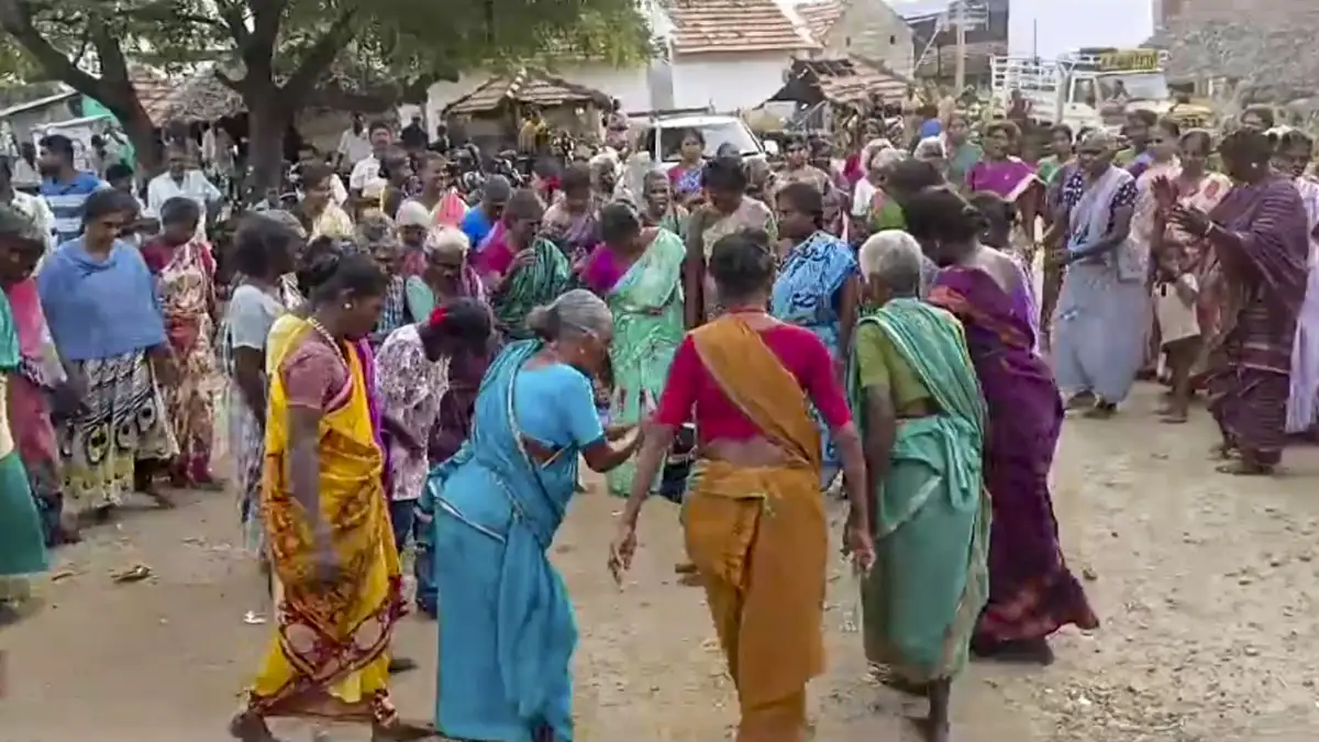 Villagers celebrate after the central government announced