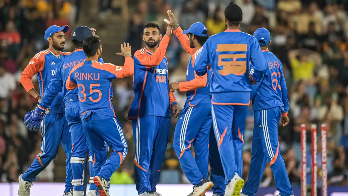 Varun Chakravarthy celebrating with Indian teammates.