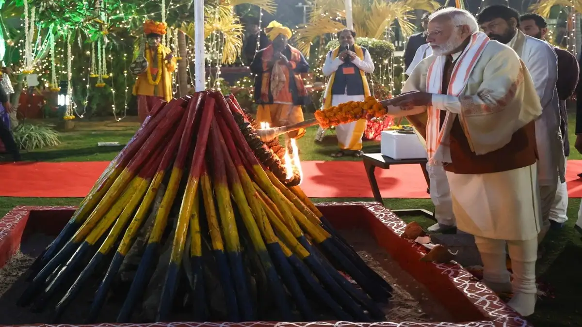 PM Modi lights the Bhogi fire.