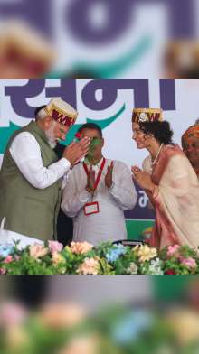 PM Modi campaigns for Kangana Ranaut in Mandi, actress greets him with a rose | IN PICS