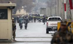 Security forces inspect the site of a suicide bombing in