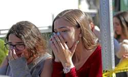 Students released from a lockdown are overcome with emotion