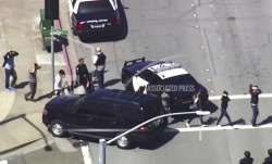 This image taken from video from KGO-TV shows people walk