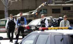 Armed law enforcement personnel exit YouTube headquarters,