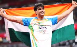 Neeraj Chopra of Team India celebrates winning the gold