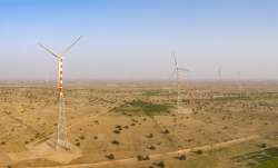 Adani Green switches on India first hybrid power plant, Adani Green news, Adani Green first hybrid p