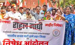 Thane: BJP workers raise slogans during a protest against