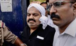 Mafia-turned-politician Atiq Ahmed being taken from