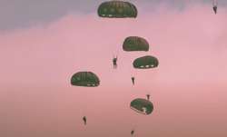 Parachutists jumped from World War II-era planes into now peaceful Normandy to kick off a week of ce