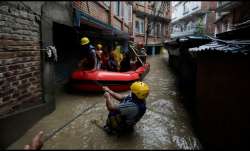 Security force members use an inflatable raft to bring