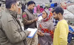 Delhi Police personnel during a campaign to identify