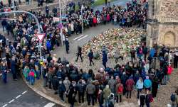 Mourners laid flowers near the scene of the deadly Christmas market attack. 