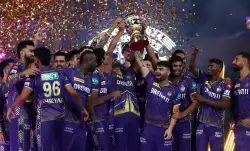 KKR with IPL trophy.