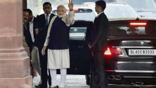 Prime Minister Narendra Modi flashes victory sign after