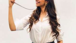 Deepika Padukone styled white shirt and black pant