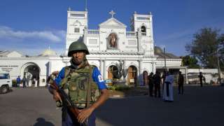 Sri Lankan air force officers stand outside St. Anthony's