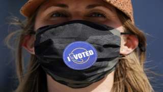 Lillian Lauer wears an I Voted sticker on her face mask