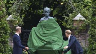 Britain's Prince William, left and Prince Harry unveil a