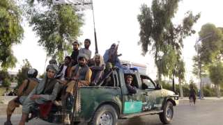 Taliban fighters patrol inside the city of Kandahar,