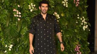 Aditya Roy Kapur wears a black kurta with small prints all