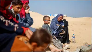 Palestinians gather at Tal Al-Sultan cemetery in Rafah amid