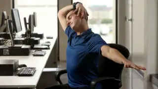 Seated Neck Stretches: Gently tilt your head to one side,