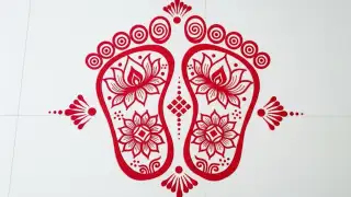 Lakshmi pad alpona design with lotus footprints