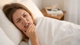 Woman with sore jaw
