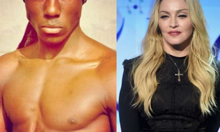 Madonna is smitten by this dishy dude.