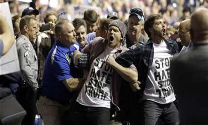 Protesters are removed during the rally