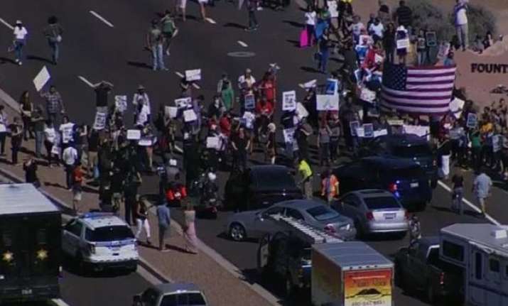 Dozens of protestors blocked traffic near an event