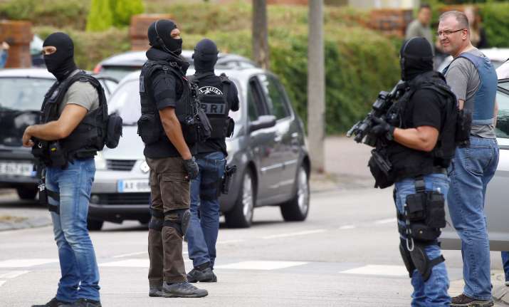 Security personnel at the sight of Normandy church attack
