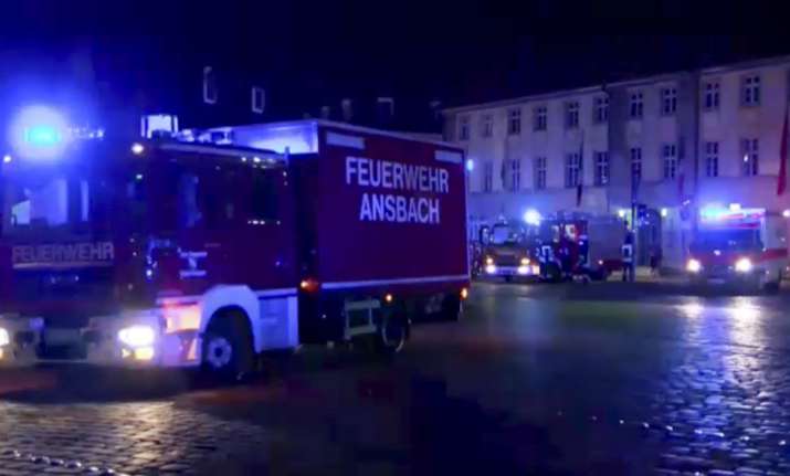 Fire trucks and ambulances stand in the city center of
