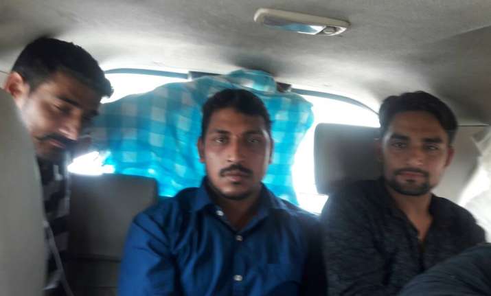 Bhim Army founder Chandrashekhar - centre - in police