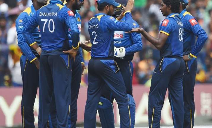 Lakshan Sandakan celebrates with his teammates