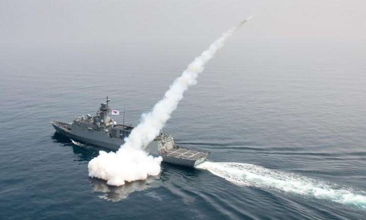 A South Korean navy ship fires a missile during a drill in