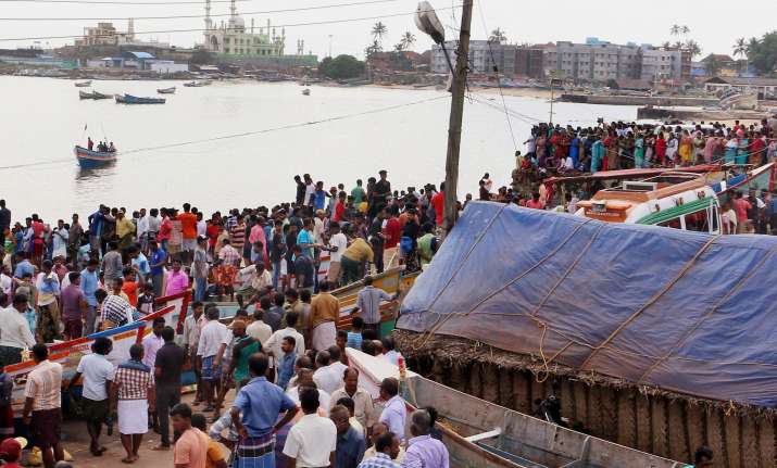 Huge crowd of anxious fishermen families and natives