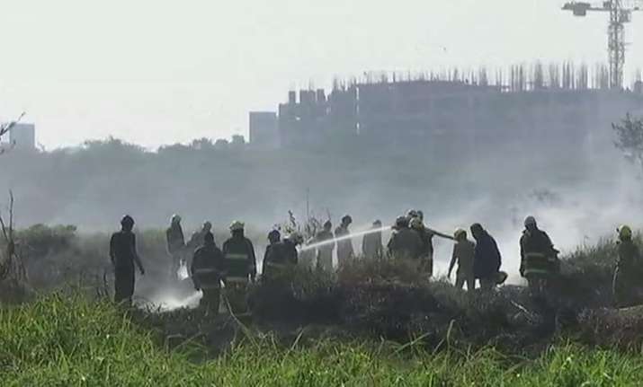 Fire engines and water bowsers from nearby civilian areas