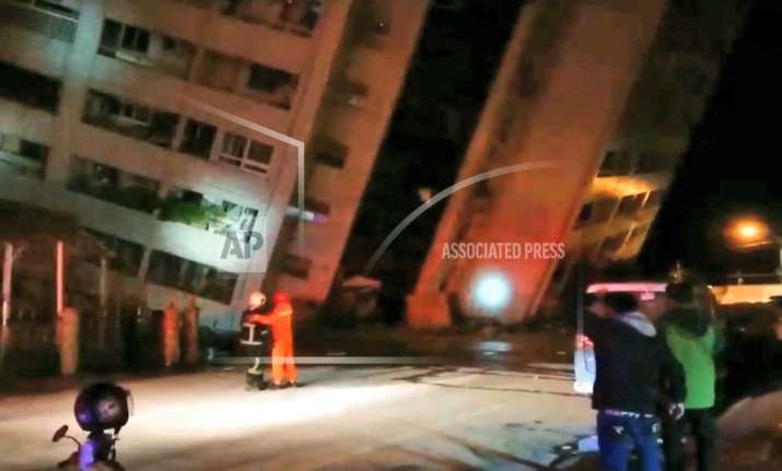 Emergency services attend after a building collapsed onto