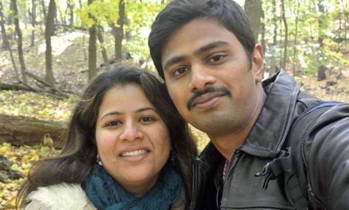 Srinivas Kuchibhotla, right, poses for a photo with his