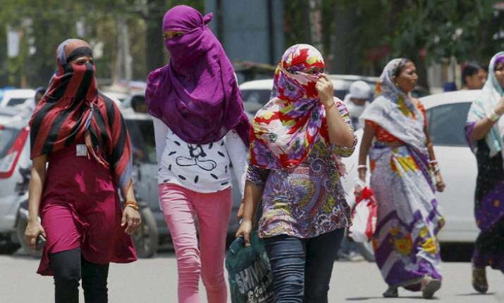 Allahabad: Girls cover their faces to beat the heat on a