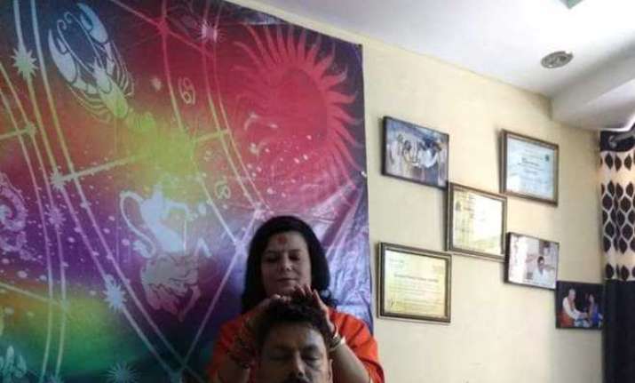 Delhi cop transferred after photo with godwoman 'blessing'
