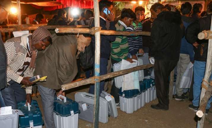 Election officers stand in queue for submission of their