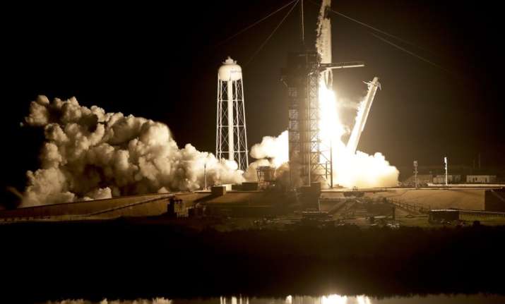 Crew capsule rockets toward space station with test dummy