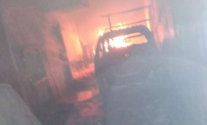 Massive fire breaks out after cylinder blasts in building