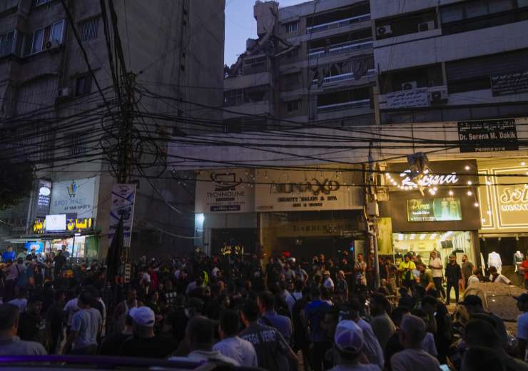 A general view shows a damaged building that was hit by an Israeli airstrike in the southern suburbs - India Tv