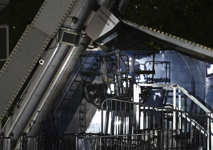 A burnt-out gondola of the Ferris wheel after a fire broke out in the Ferris wheel - India Tv