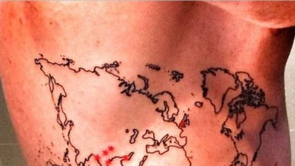 Little Tattoos — World map tattoo on Samuel's upper back.