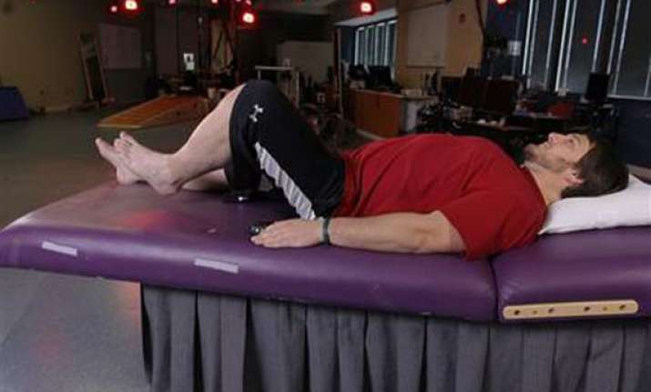 electrical device helps paralyzed men move legs