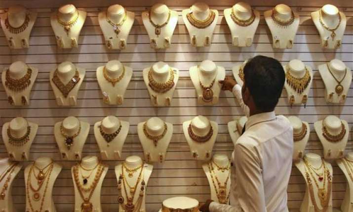 gold edges higher on stray buying silver also advances